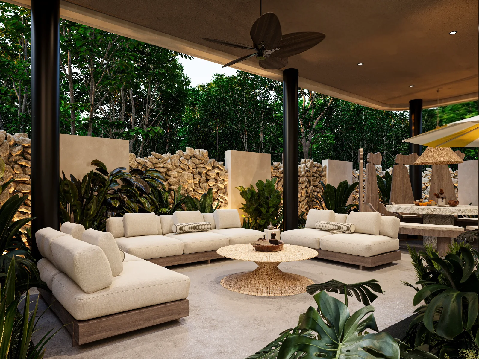 Covered terrace of a Riviera Maya villa with linen sofas, a woven table and tropical garden