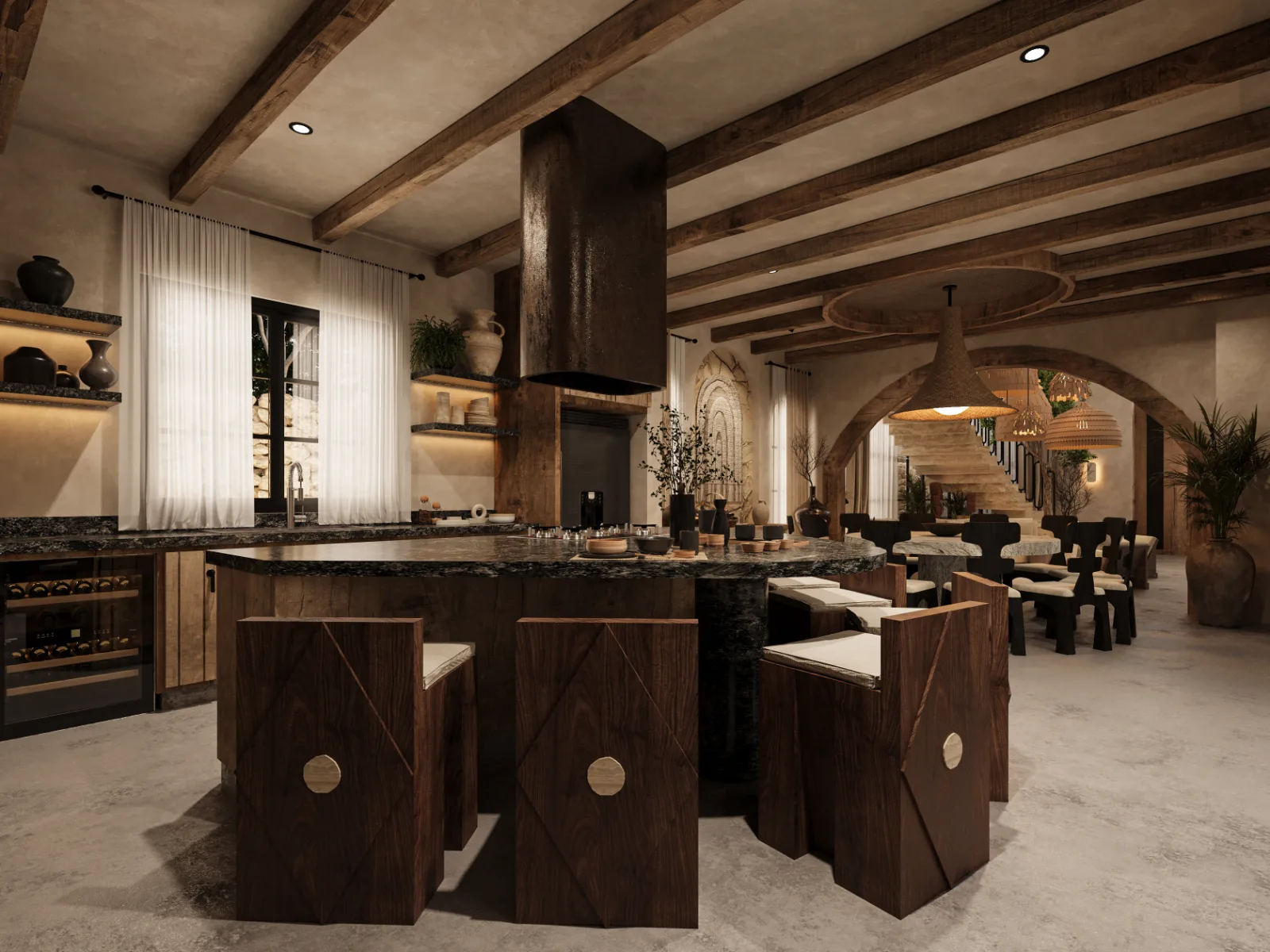 Kitchen and dining room of a Riviera Maya villa with a granite island, timber beams and arches through to the stair