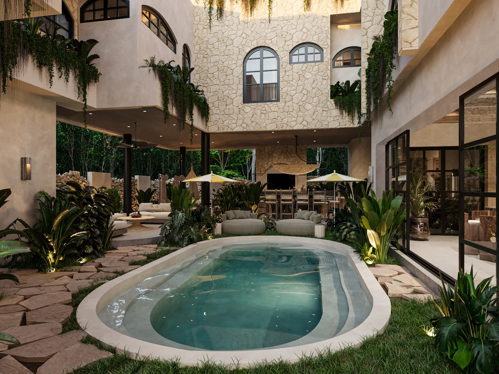 Interior courtyard of a Riviera Maya villa with a pool, stone walls and tropical planting