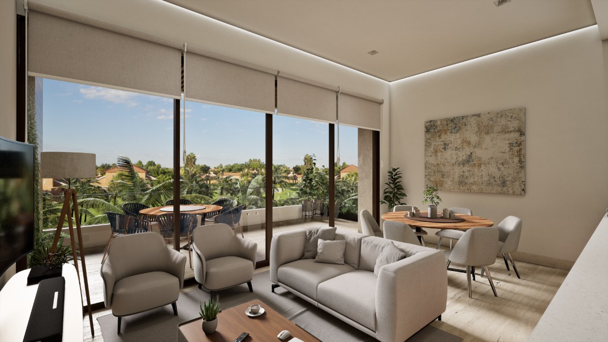 Living room of a lagoon side apartment in Cancún opening onto a terrace over the gardens