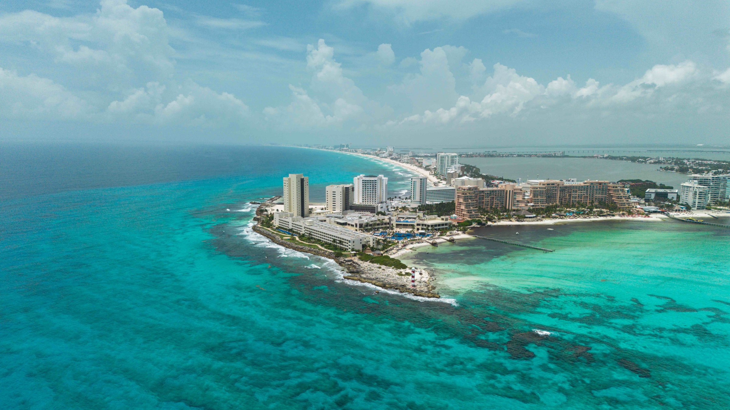 Aerial view of Punta Cancún and the Hotel Zone strip between the Caribbean reef and the Nichupté lagoon