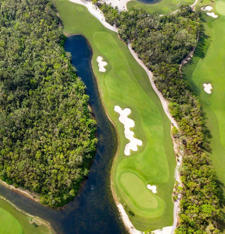 Overhead view of a Gran Coyote fairway at Corasol between the lake and the jungle, beside the La Escondida lots