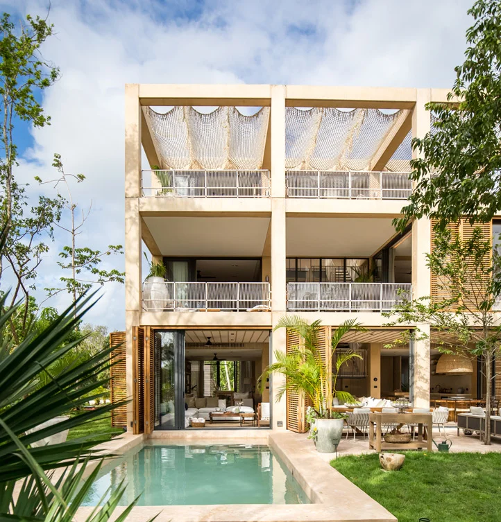 Rear elevation of a Palm Villas estate home at Corasol, private pool and shaded terraces over three levels