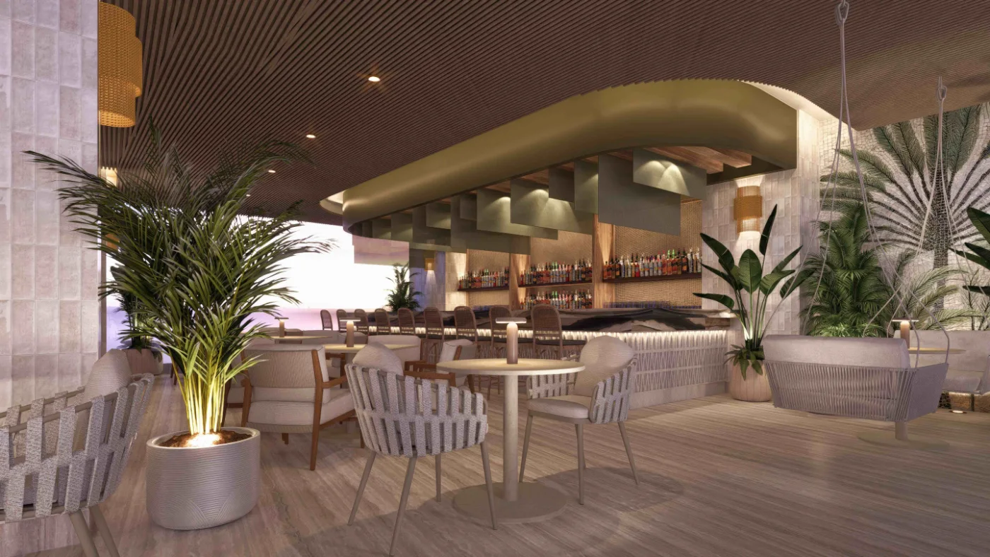 Bar et lounge en toiture au coucher du soleil, palmiers et mobilier tressé