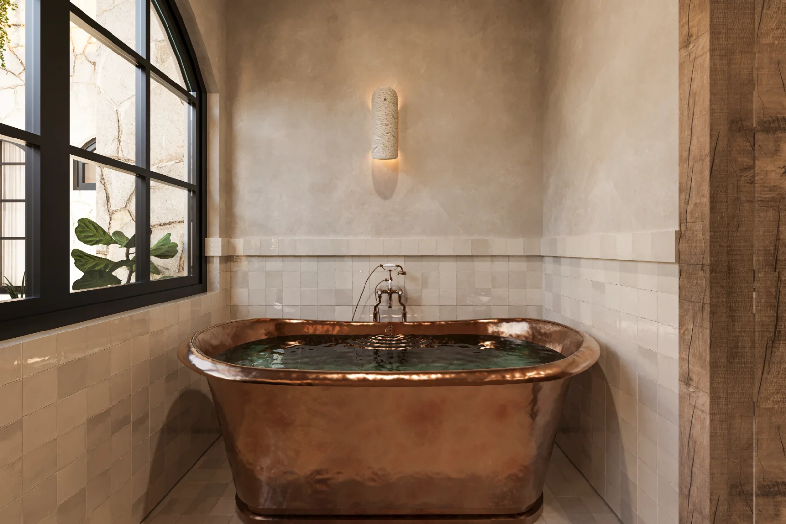 Copper soaking tub under an arched steel window in a Riviera Maya villa bathroom