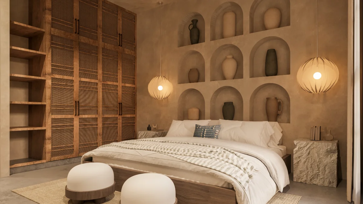 Bedroom of a Riviera Maya villa with a plaster niche wall of ceramic vessels, a carved timber screen and paper globe pendants