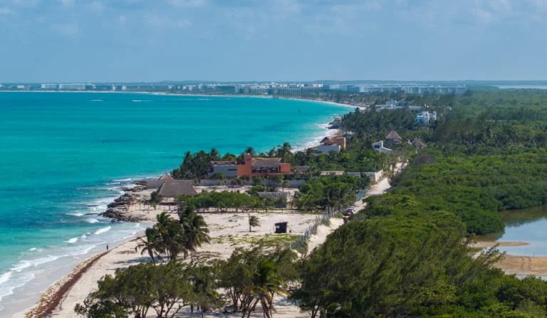 The Costa Mujeres and Playa Mujeres hotels seen up the coast from Isla Blanca, the built alternative on the same road