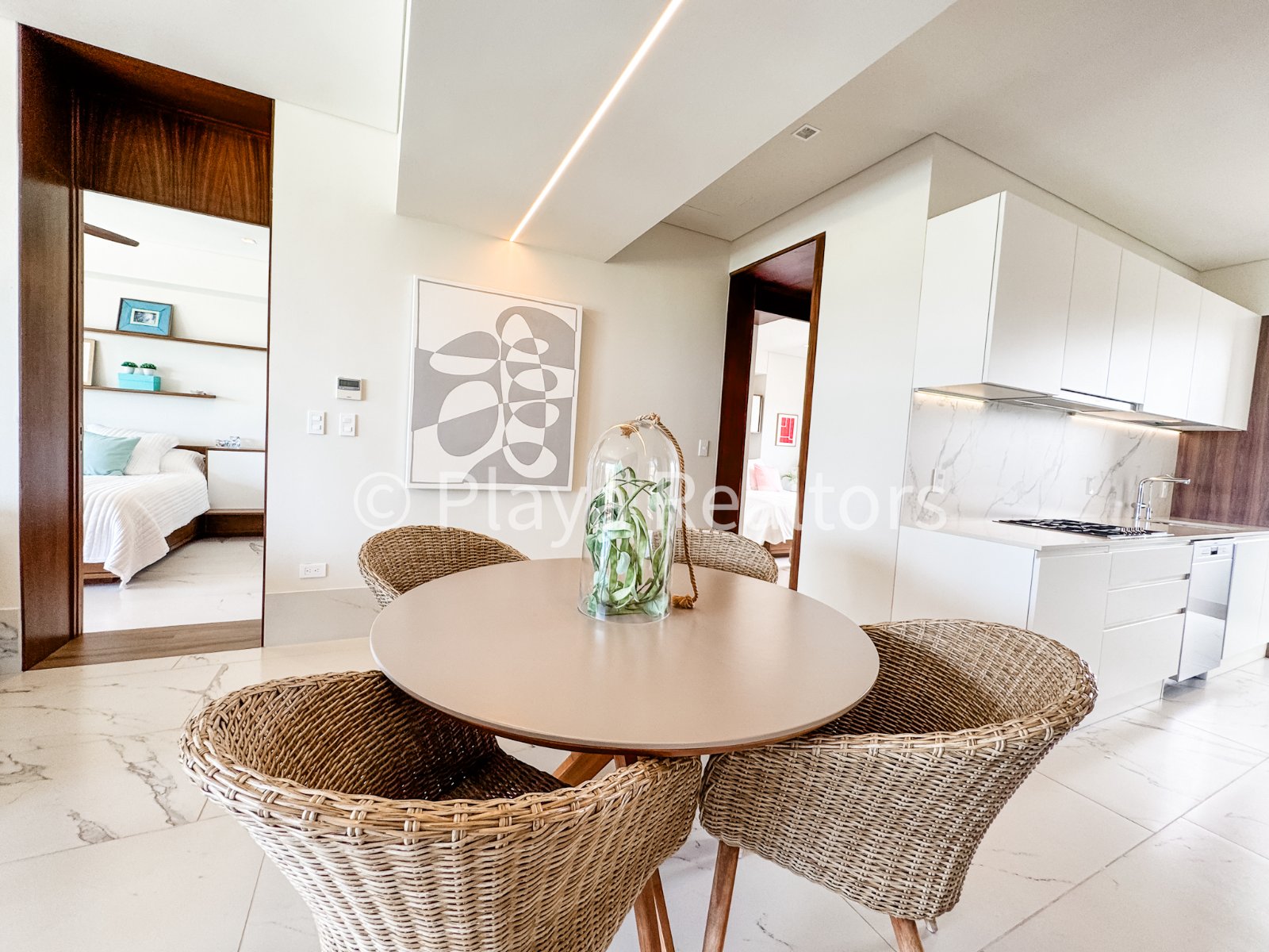 Comedor y cocina de un departamento en Puerto Cancún