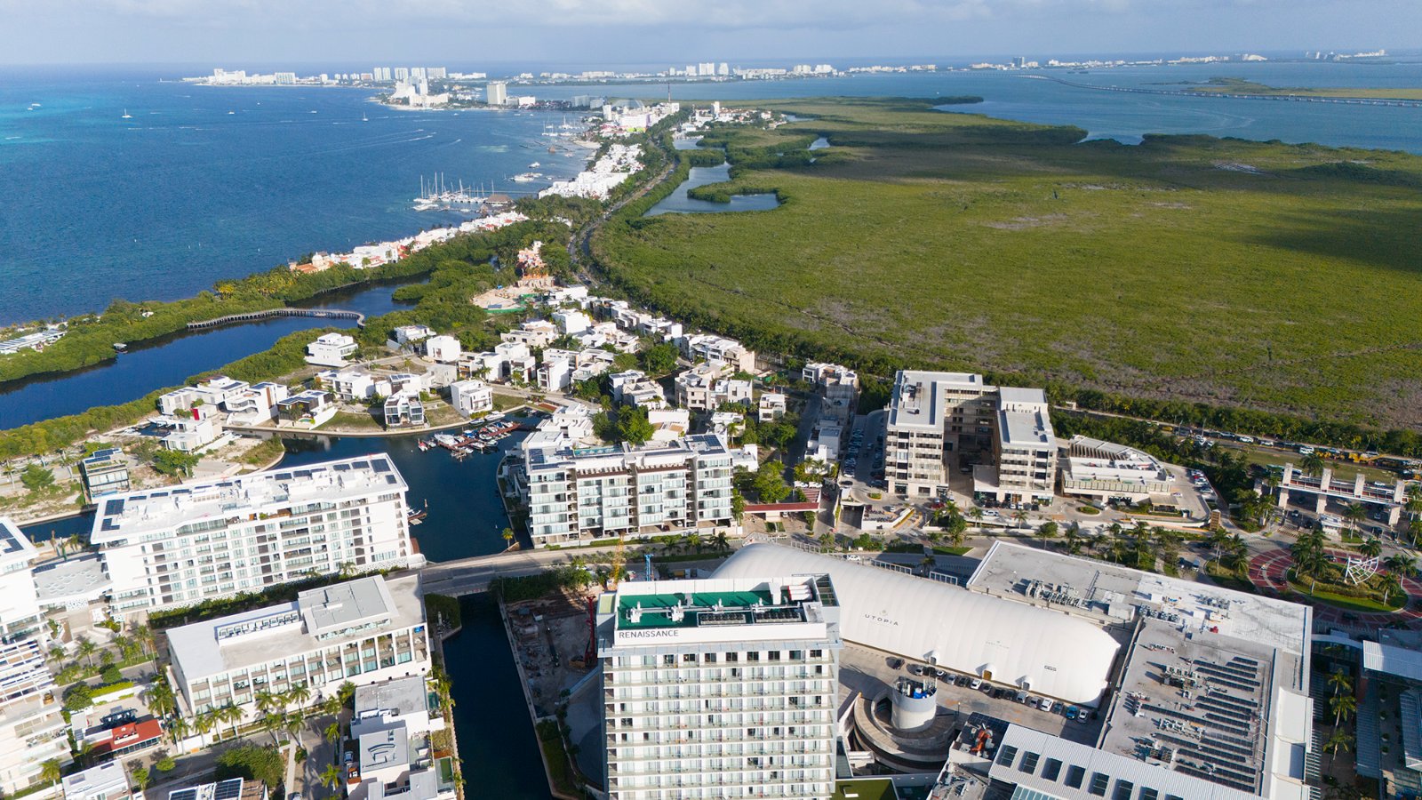 Aerial view of canal front homes with private docks in Puerto Cancún