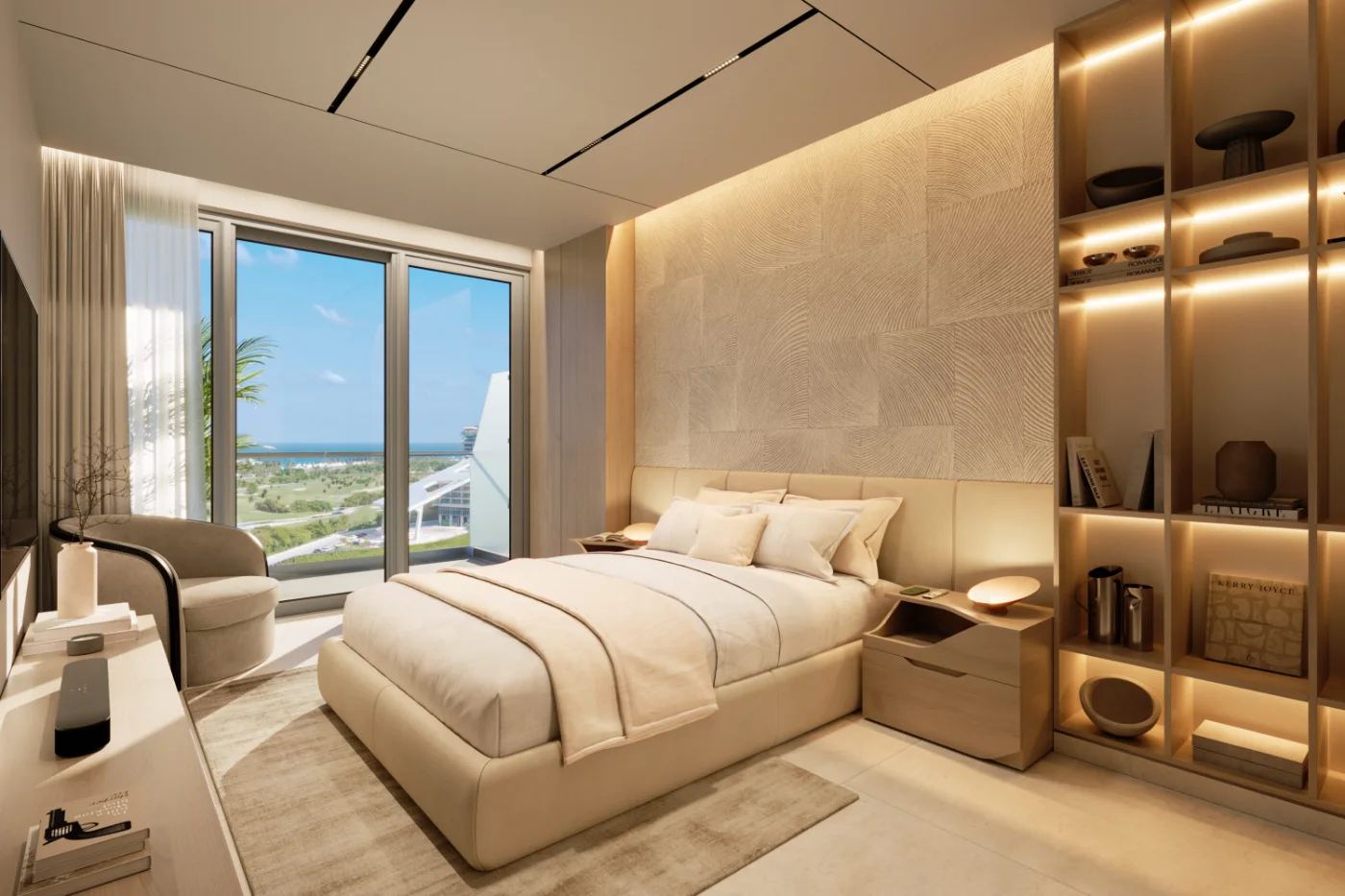 Bedroom of a contemporary condominium with floor to ceiling glass onto the golf course and the sea