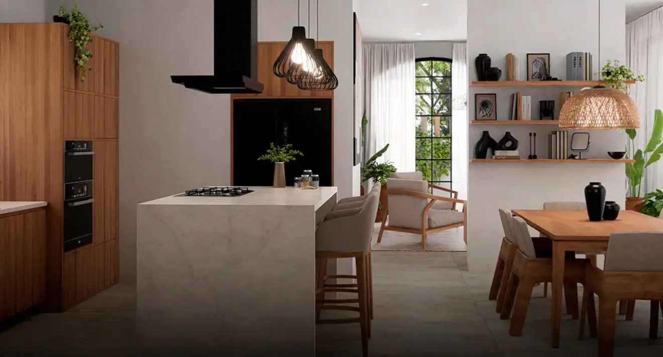 Intérieur d'une villa Las Flores à Tulum Country Club, cuisine avec îlot en marbre ouverte sur la salle à manger et le séjour