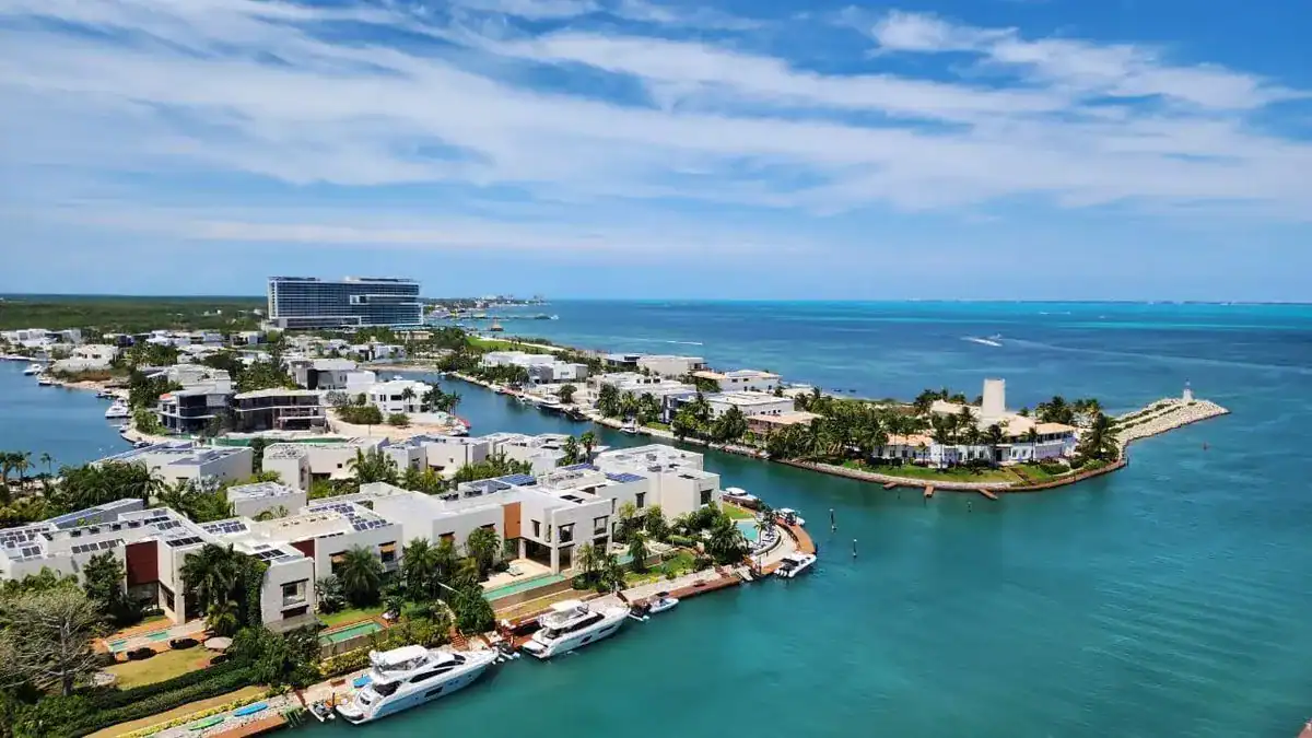Open-concept penthouse living room with floor-to-ceiling windows and panoramic ocean views.