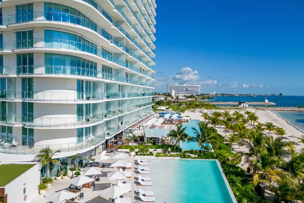 Crowd enjoying the vibe at a luxury beach club in Cancun