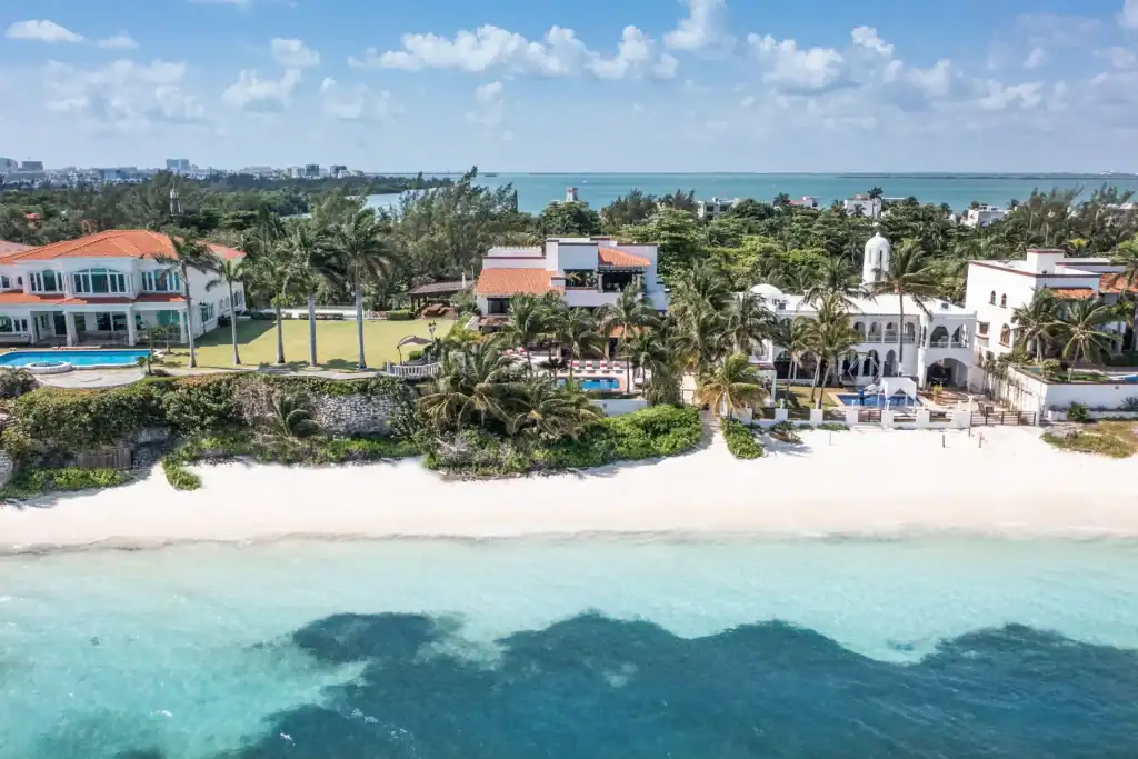 Luxury beachfront villa for sale in Cancun with private infinity pool and ocean view.