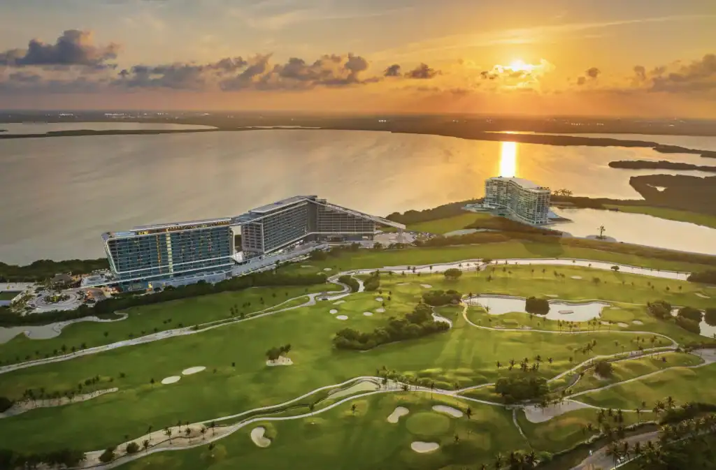 Aerial view of a gated luxury community nestled along the Cancun coastline